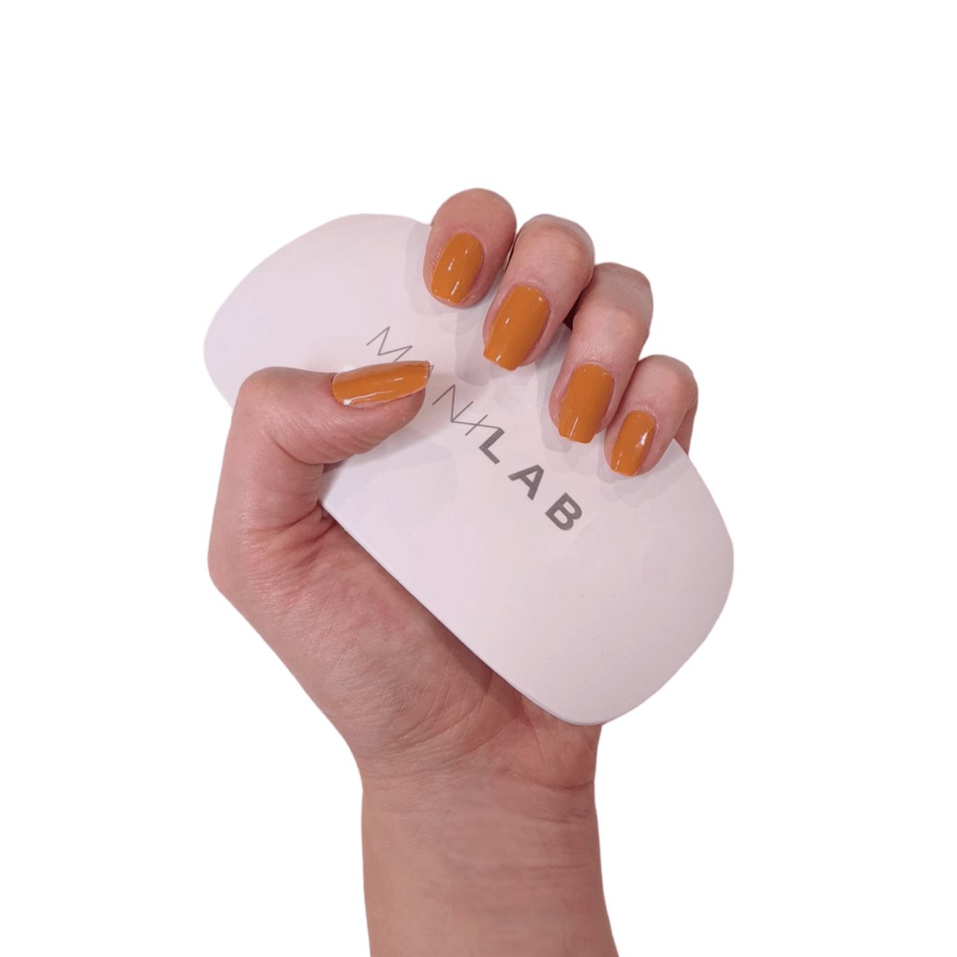 Our burnt orange semi-cured gel nails displayed on a hand 